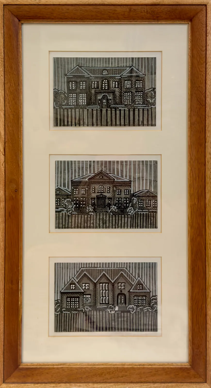Three drawings of houses in marker and white gel pen on cardstock, stacked vertically in a single cherry wood frame.