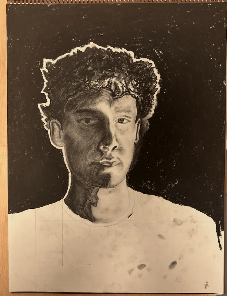 A charcoal self-portrait drawing of Henry Rhoden, rendered in grey and black tones.